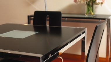 Black dining table and chairs, with square chrome chair, desk, dining room, furniture, interior design, office, product design, table, orange, black