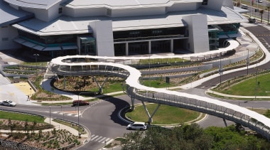 Long snaking pedestrian bridge with white canopy overhead, aerial photography, architecture, bird's eye view, building, city, fixed link, metropolitan area, structure, urban area, urban design, water, black, gray