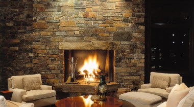 View of the living area, stone fireplace, stone ceiling, fireplace, hearth, home, interior design, lighting, living room, lobby, wall, wood burning stove, black, brown