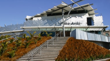 Exterior view of entrance way to Puke Ariki, architecture, building, roof, structure, brown, blue