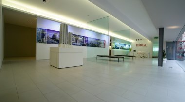 Showroom area with cream stone floor tiles, low exhibition, floor, interior design, lobby, real estate, tourist attraction, gray