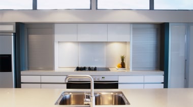 view of this clean pearl kitchen showing the countertop, interior design, kitchen, gray, white