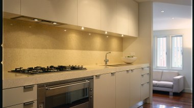 view of the modern kitchen area showing kitchen cabinetry, countertop, cuisine classique, interior design, kitchen, room, under cabinet lighting, brown