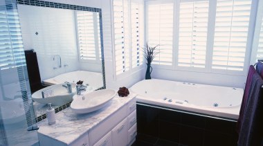 Bathroom with white wall tiles, black floor tiles bathroom, bathtub, floor, home, interior design, property, room, window, white, gray