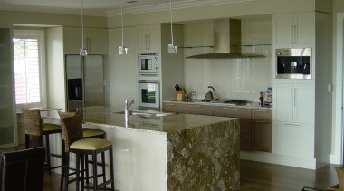 Kitchen with granite benchtop, bar stools at island, cabinetry, countertop, cuisine classique, floor, flooring, interior design, kitchen, real estate, room, gray, brown