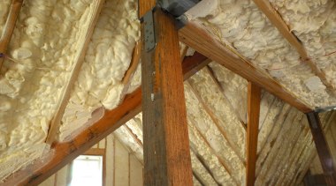 View of the Icynene insulation in the roof. attic, beam, building insulation, ceiling, log cabin, lumber, roof, wood, brown