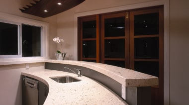 Curved polished concrete kitchen benchtop and breakfast bar, cabinetry, ceiling, countertop, interior design, lighting, room, under cabinet lighting, black, brown