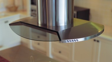 Stainless steel and glass canopy hood set over countertop, glass, brown