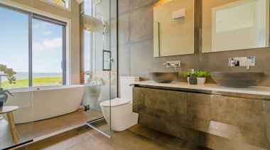 Putting the bath in the shower enclosure enables 