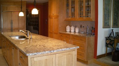 View of a kitchen are, wooden cabinetry, cream cabinetry, countertop, cuisine classique, floor, flooring, hardwood, home, interior design, kitchen, real estate, room, tile, brown