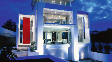 view of the house showing a red double architecture, elevation, estate, facade, home, house, interior design, lighting, majorelle blue, property, real estate, sky, villa, blue