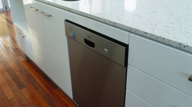 view of the bosch dishwasher - view of cabinetry, countertop, floor, flooring, furniture, hardwood, kitchen, sink, wood, gray, white