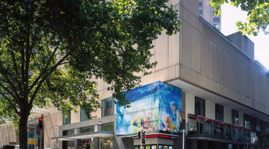 An exterior view of the mall which is architecture, building, city, commercial building, condominium, facade, metropolis, metropolitan area, mixed use, neighbourhood, street, tree, black