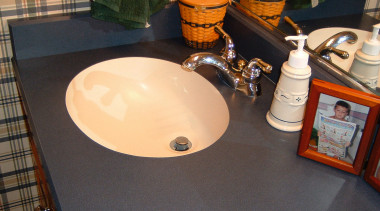 view of  the undermount ktichen sink - bathroom, ceramic, countertop, floor, flooring, furniture, plumbing fixture, room, sink, table, tile, black