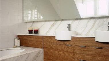 A view of a bathroom, brown tiled floor, architecture, bathroom, countertop, floor, flooring, interior design, property, real estate, room, sink, tap, tile, wall, wood flooring, gray