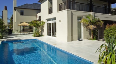 Exterior of masonry home with pool, paving, gardens architecture, condominium, elevation, estate, facade, home, house, mansion, property, real estate, residential area, swimming pool, villa, blue