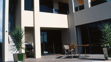 Exterior view of two level masonry home with apartment, architecture, building, condominium, elevation, estate, facade, home, house, official residence, property, real estate, residential area, villa, window, white, black