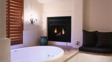 view of the bathroom featuring fireplace, antique wall bathroom, estate, fireplace, floor, flooring, hearth, interior design, property, real estate, room, gray