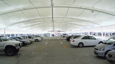 view of the all weather membrane car park airport terminal, building, car, hangar, luxury vehicle, motor vehicle, parking, parking lot, structure, gray