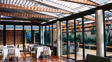 Restaurant sun room area with sofas, tables and daylighting, interior design, real estate, roof, white, black