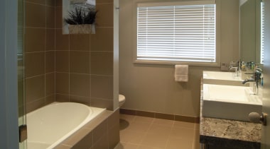 A view of a bathroom, brown tiled floor bathroom, floor, home, interior design, property, room, sink, tile, window, brown