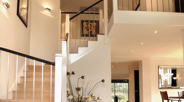 A view of a staircase, cream tiled floor, architecture, ceiling, daylighting, estate, floor, flooring, handrail, hardwood, home, house, interior design, living room, lobby, property, real estate, stairs, wood flooring, orange
