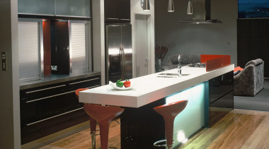 A view of a kitchen, wooden flooring, bar cabinetry, countertop, interior design, kitchen, room, black, gray