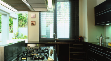 A view of a kitchen area, wooden cabinetry ceiling, countertop, interior design, kitchen, room, window, black