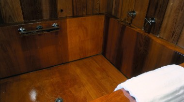 A view of the wooden bathtub. - A floor, flooring, hardwood, laminate flooring, room, wall, wood, wood flooring, wood stain, brown