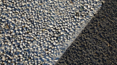 Closeup view of patterned street paving. - Closeup asphalt, cobblestone, gravel, road surface, texture, water, black, gray