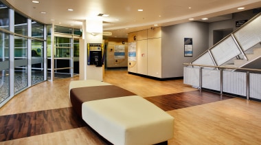 Lobby area of hospital with two toned flooring ceiling, floor, flooring, interior design, lobby, orange