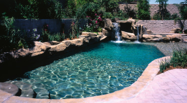 view of the exotic pool area featuring waterfall, backyard, body of water, landscape, landscaping, leisure, outdoor structure, pond, swimming pool, water, water feature, water resources, watercourse, yard, black