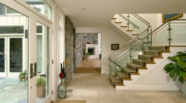 view of the remodelled living are that created architecture, daylighting, estate, floor, flooring, handrail, home, house, interior design, lobby, real estate, stairs, orange, brown