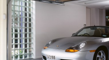 view of this garage featuring a garage window automotive design, automotive exterior, car, garage, material, motor vehicle, porsche, sports car, technology, vehicle, vehicle door, window, gray