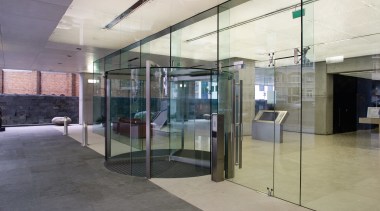 A view of the glass used on the architecture, door, floor, glass, real estate, gray