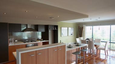 view of this kitchen that features polished timber cabinetry, countertop, cuisine classique, floor, flooring, home, interior design, kitchen, property, real estate, room, window, gray, brown
