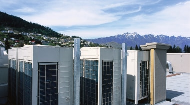 An exterior view of the heating and cooling architecture, building, facade, home, house, real estate, sky, window, white