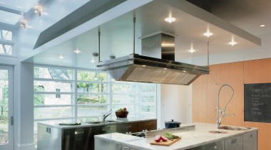 A view of the homes large kitchen area. cabinetry, ceiling, countertop, cuisine classique, daylighting, floor, interior design, interior designer, kitchen, real estate, gray