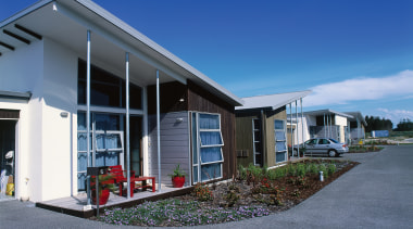 An exterior view of the retirement village. - cottage, facade, home, house, property, real estate, residential area, sky, blue, gray