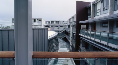 An exterior view of the Zone23 building. - apartment, architecture, building, condominium, facade, structure, gray, black