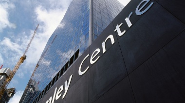 A view of the signage placed about the architecture, building, daytime, sky, structure, black, white
