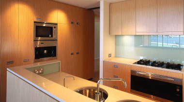 A view of a kitchen, wooden cupboards, white cabinetry, countertop, interior design, kitchen, real estate, room, orange, brown