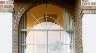 A view of a home designed by Domaine arch, architecture, brickwork, daylighting, facade, structure, window, white, brown