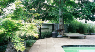 sandstone pavers surround the pool, planting connects the backyard, courtyard, estate, garden, grass, home, house, landscape, landscaping, lawn, outdoor structure, plant, property, real estate, tree, walkway, yard, green