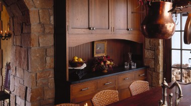 view of the dining area featuring oak table, fireplace, furniture, hearth, home, interior design, lighting, living room, room, black