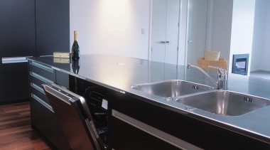 Kitchen with dark coloured cabinetry, stainless steel benchtop cabinetry, countertop, floor, glass, interior design, kitchen, sink, gray, black