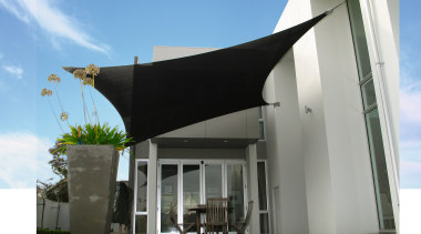A view of a shade system. - A architecture, facade, house, shade, gray