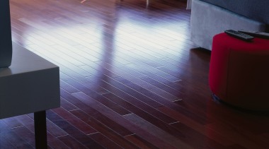 Room with timber flooring, and black lounge chair. chair, floor, flooring, furniture, hardwood, interior design, laminate flooring, living room, table, wood, wood flooring, wood stain, black