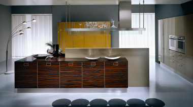 A view of a Pedini kitchen with brown cabinetry, countertop, cuisine classique, floor, flooring, interior design, kitchen, product design, room, gray, black