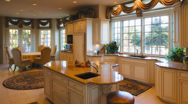 Open plan traditional style kitchen with cream cabinetry, cabinetry, countertop, cuisine classique, interior design, kitchen, real estate, room, window, brown
